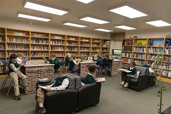 Manassas Christian School, Our Mission, Students reading books in the large library