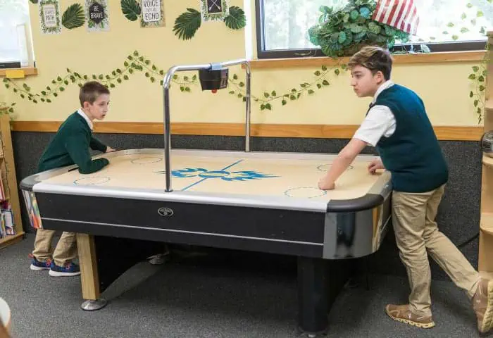 Manassas Christian School, Extended Care, picture of students playing air hockey after school
