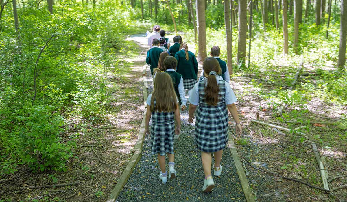 Manassas Christian School, Our Campus, picture of a class walking on the schools walking trail